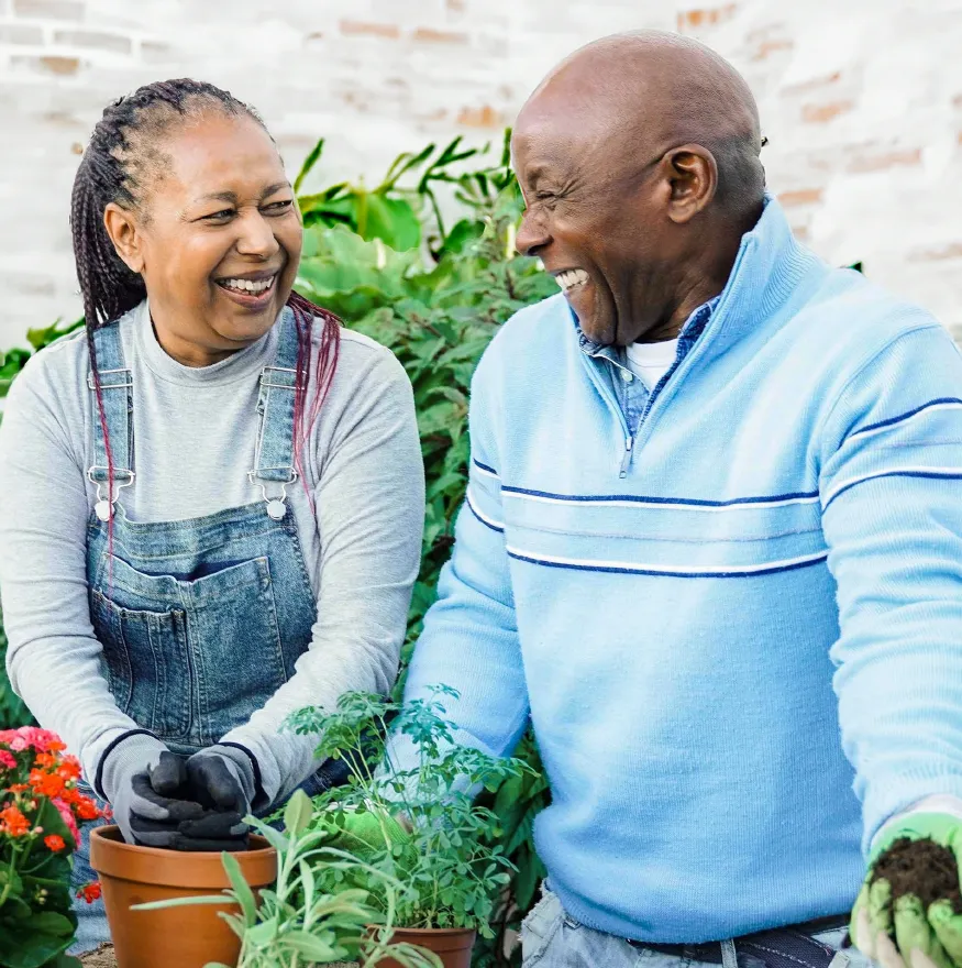 Smiling couple gardening